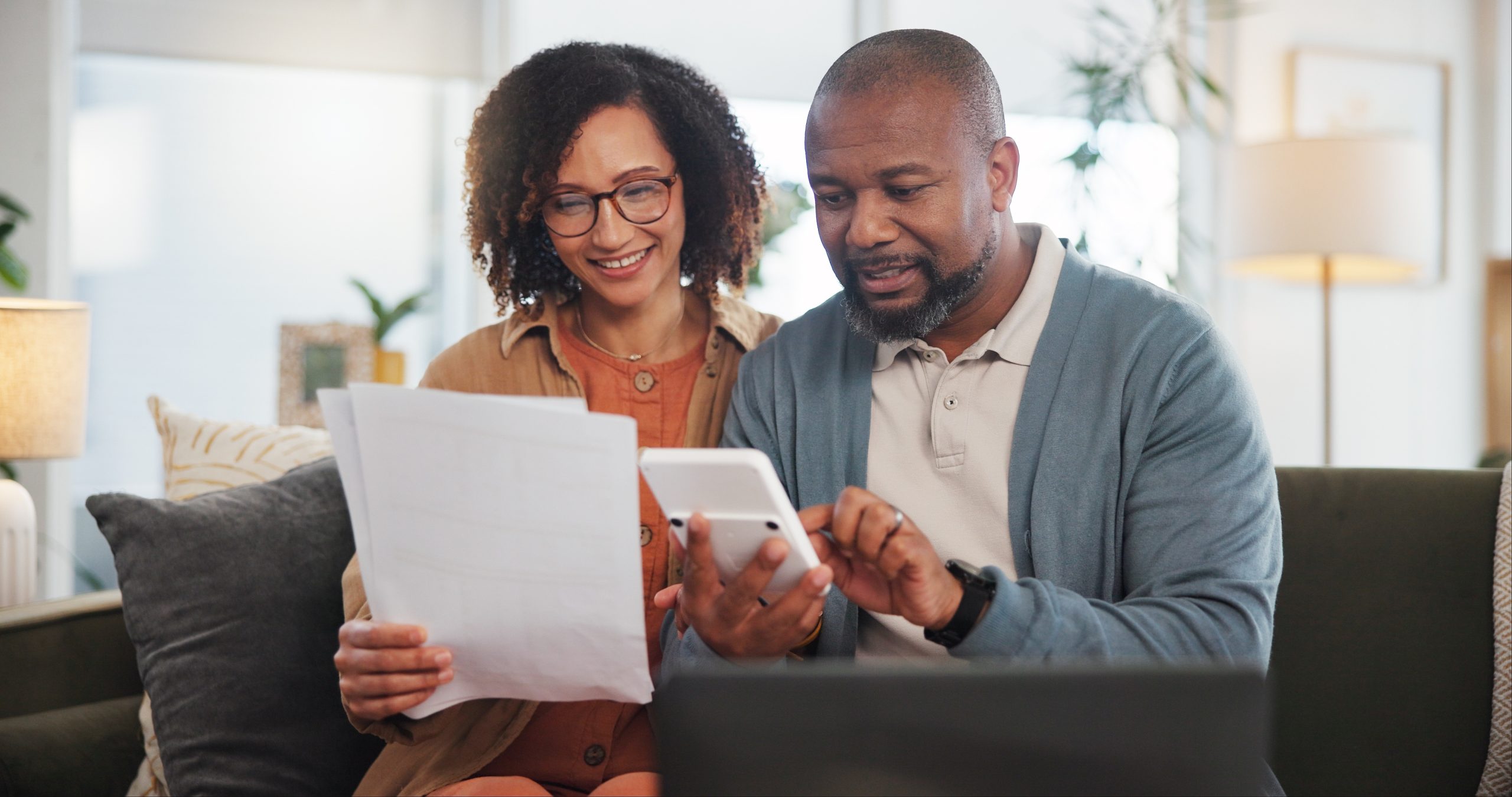 Federal employee couple reviewing retirement benefits and planning their future together